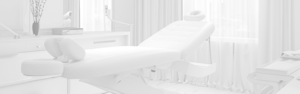 A modern, sterile treatment bed in a luxury clinical room at Advanced Aesthetics Med Spa in Boston, MA.